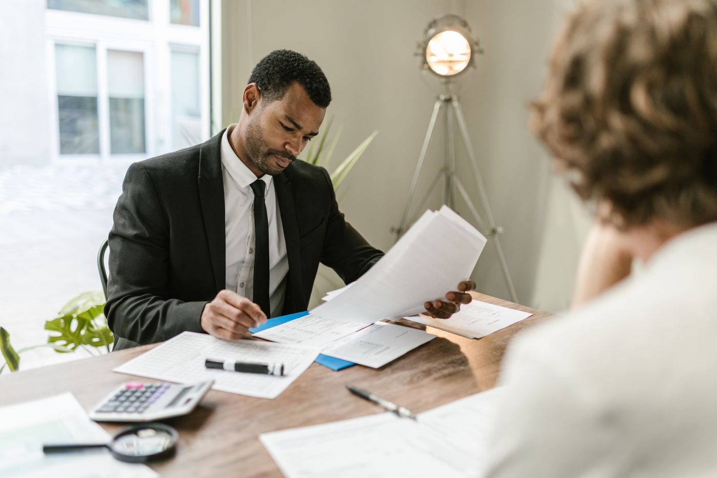 Person reviewing finances after a setback