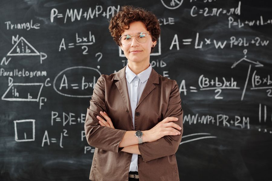 Teacher in front of a classroom board